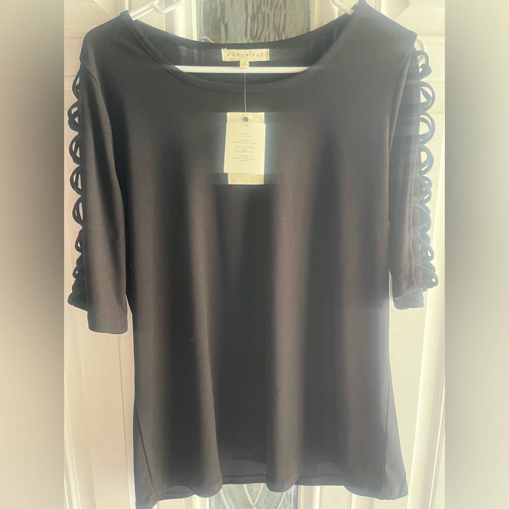 Black 1/2 length sleeve with stylish loop sleeves. Brand New! Size medium